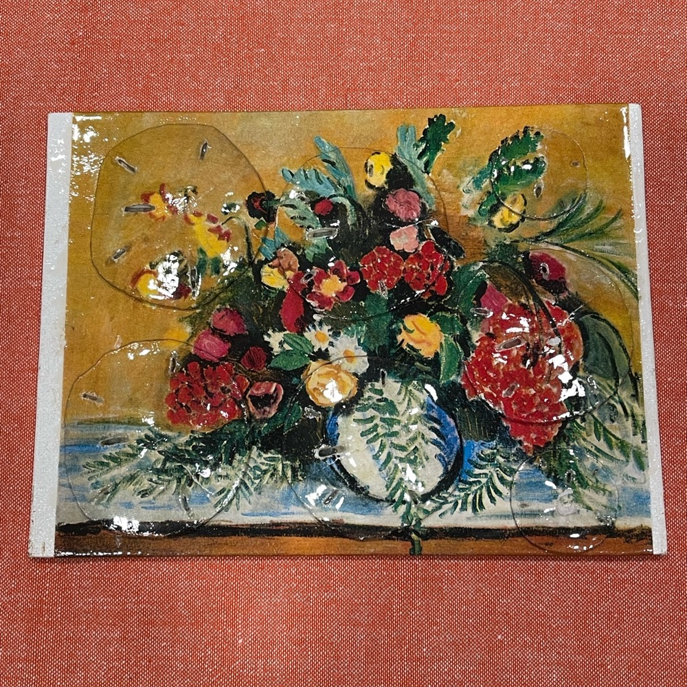 Unique painting set by artist using sand dollars.